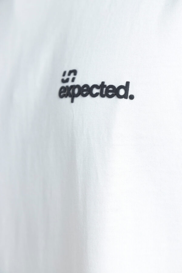 T-shirt Unexpected Basic White un Black